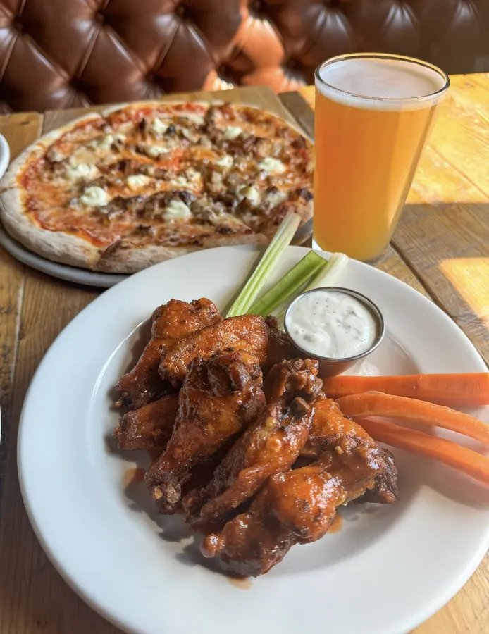 White pizza, wings and a pint of beer