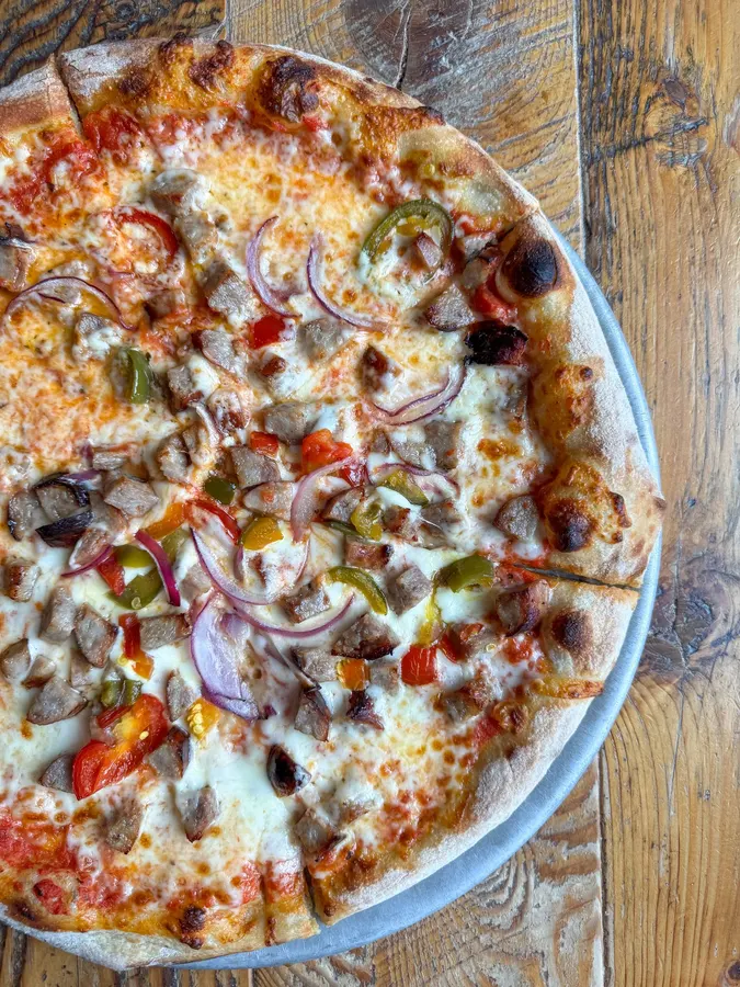 Veggie pizza with red onion and peppers